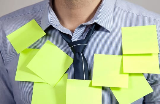 Businessman with plenty of post it notes