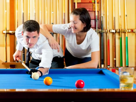 couple playing billiard expertise teacher and beautiful girl