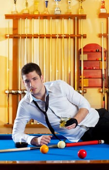 Billiard handsome player man drinking some alcohol in club