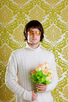 retro hip young man vintage glasses holding valentines flowers bouquet on wallpaper