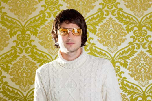 retro hip young man with vintage glasses and winter  turtleneck sweater on wallpaper