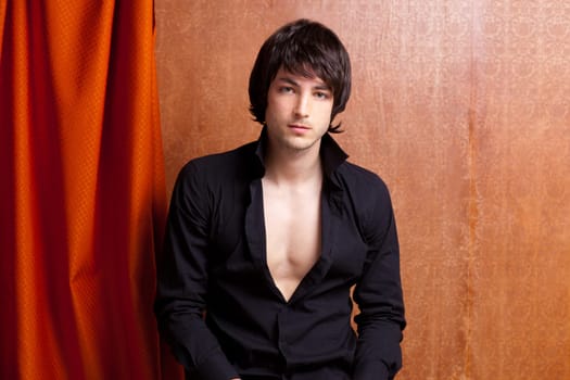 british indie pop rock look young man on orange brown retro background