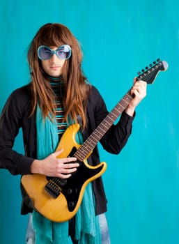 humor retro vintage hip heavy seventies guitar player with sunglasses