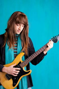 Hard rock seventies electric guitar player man with long hair