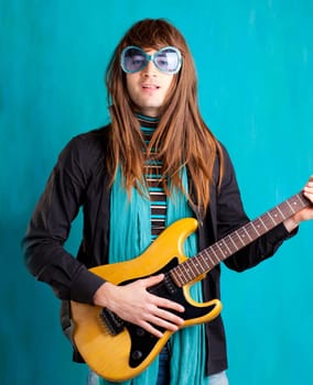humor retro vintage hip heavy seventies guitar player with sunglasses