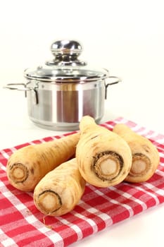 Parsnips on a red tea towel