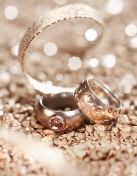 Luxury used Rings with a golden ribbon on a blurry background