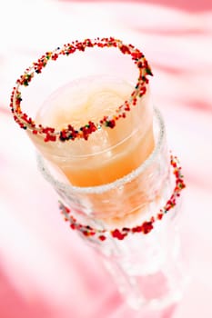 Banana Smoothie with ice cubes in stacked glasses for summer cocktail concepts