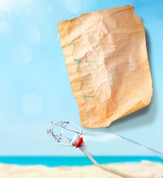 Empty Message Paper with an empty bottle with a sky background on a sandy beach