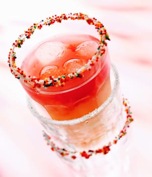 Cool Cherry Drink or Smoothie with ice cubes in stacked glasses for summmer cocktail concepts