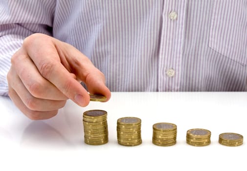 Increase your savings. hand put coin to money staircase