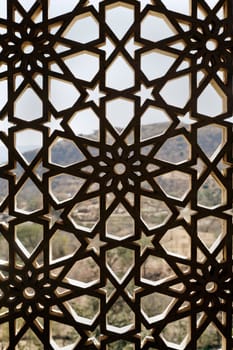 Indigenous concrete craft work of Rajasthan India on a window opening, grid design allows air and light circulation but prevents the nesting of birds