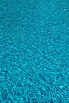 The Most beautiful clear pool water reflecting in the sun