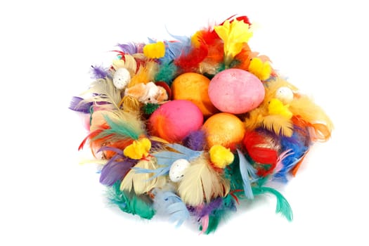 Homemade Easter decoration with colored eggs on a white background