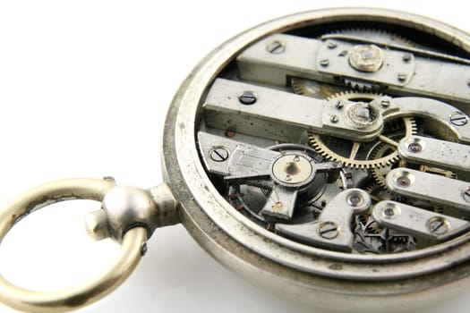 old pocket watch mechanism on white background