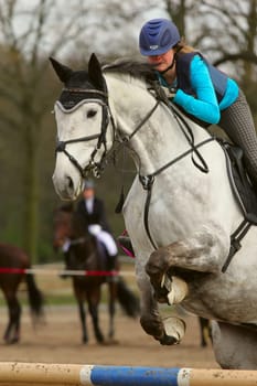 TRESTINA - APRIL 09: Unidentified rider in action at "Jump equestrian facilities"" on April 09, 2011 in Trestina (Czech Republic)"