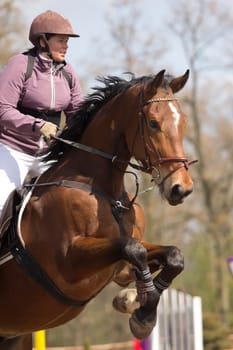 TRESTINA - APRIL 09: Unidentified rider in action at "Jump equestrian facilities"" on April 09, 2011 in Trestina (Czech Republic)"