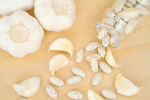 Garlic and herbal supplement pills, alternative medicine concept