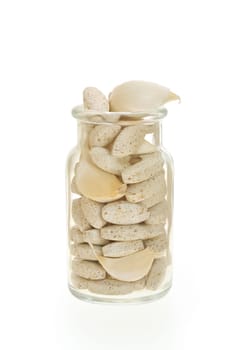 Garlic and herbal supplement pills isolated, alternative medicine concept