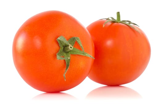 two ripe tomatoes with reflection on white background