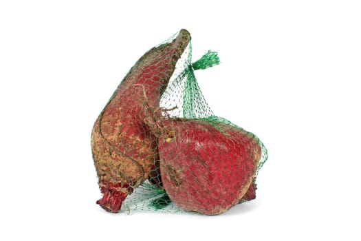 Red beet in plastic net isolated on white