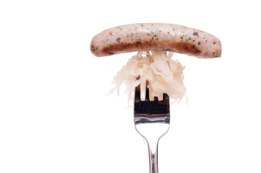 Bratwurst with sauerkraut and fork and copy space