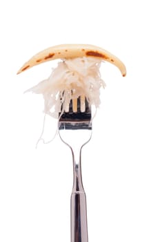White isolated fried potato noodle with sauerkraut on a fork