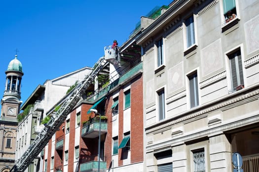 Photo of Firemans on crane
