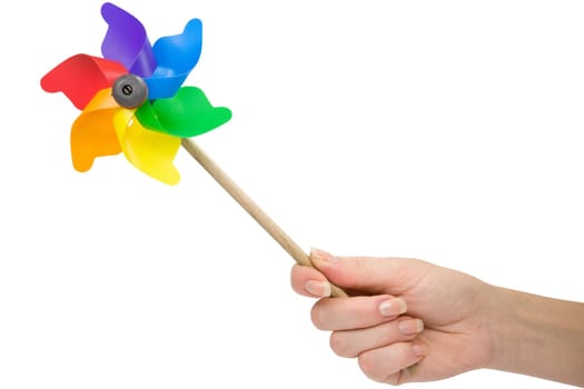 hand with a color pinwheel over a white background