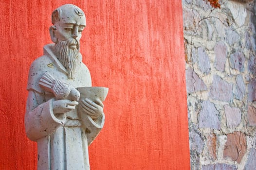 Saint Francis statue at the entrance of a Mexican church