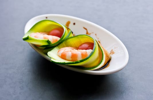 Appetizer with zucchini, shrimp and tomatoes