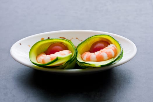 Appetizer with zucchini, shrimp and tomatoes