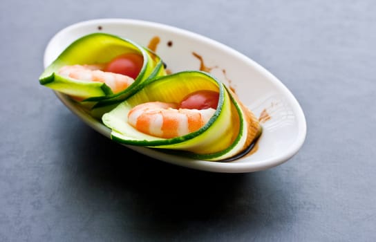 Appetizer with zucchini, shrimp and tomatoes