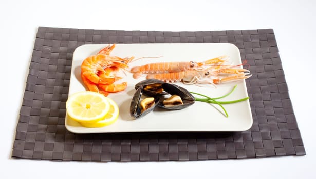 Mussels lemon and crustacean on dish