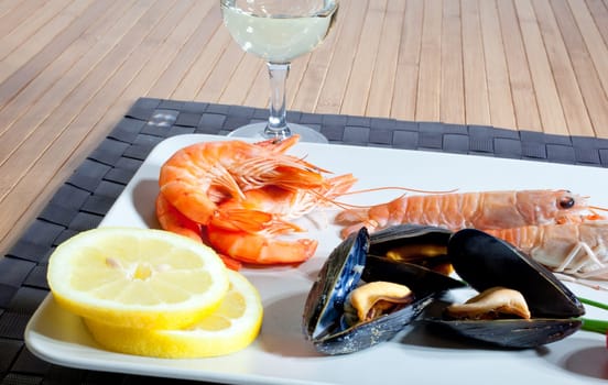 Mussels lemon and crustacean on dish
