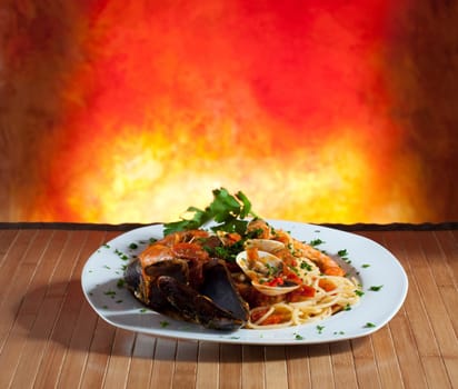 Spaghetti with mussels on a orange background
