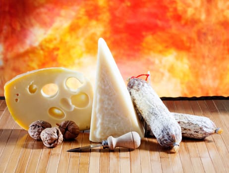 Italian cheese and salumi on a orange background
