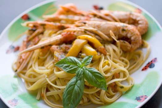 Italian spaghetti with tomato sauce, basil and shrimp