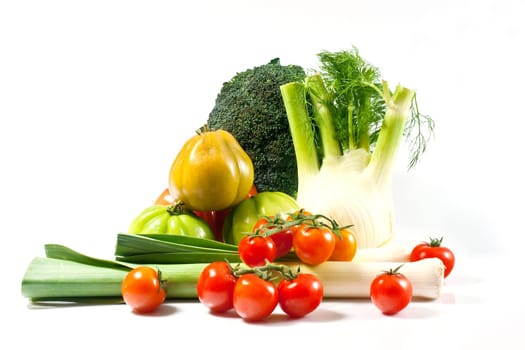 Leek, fennel, broccoli, and tomatoes isolated on a white background