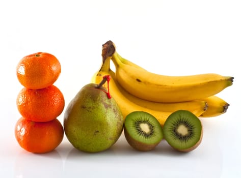 Decana pear, kiwi, tangerines and bananas on white background