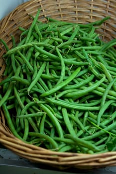 Fresh Green Beans inside a wicker basket