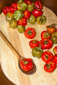 Red hot chili peppers on cutting board