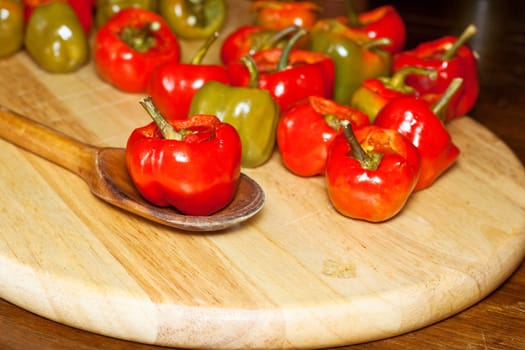Red hot chili peppers on cutting board