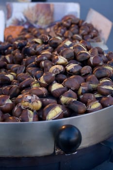 Roasted chestnuts inside a iron plate