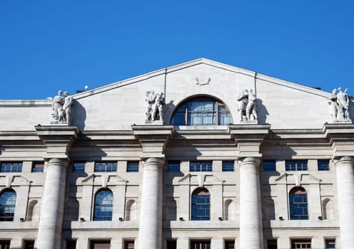 Palazzo della borsa. Exchange building on dramatic sky, Milan - Italy