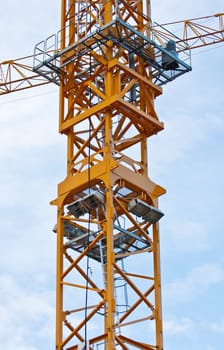 Yellow crane on blue sky