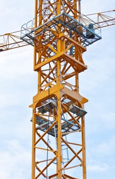 Yellow crane on blue sky