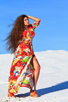 Beautiful woman with long hair in desert