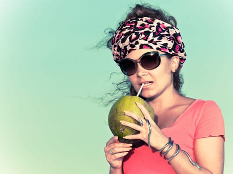 Beautiful young woman with coconut