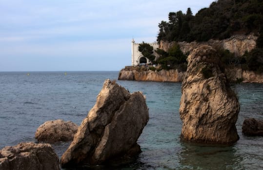Rock on the sea, Miramare castle. Trieste - Italy